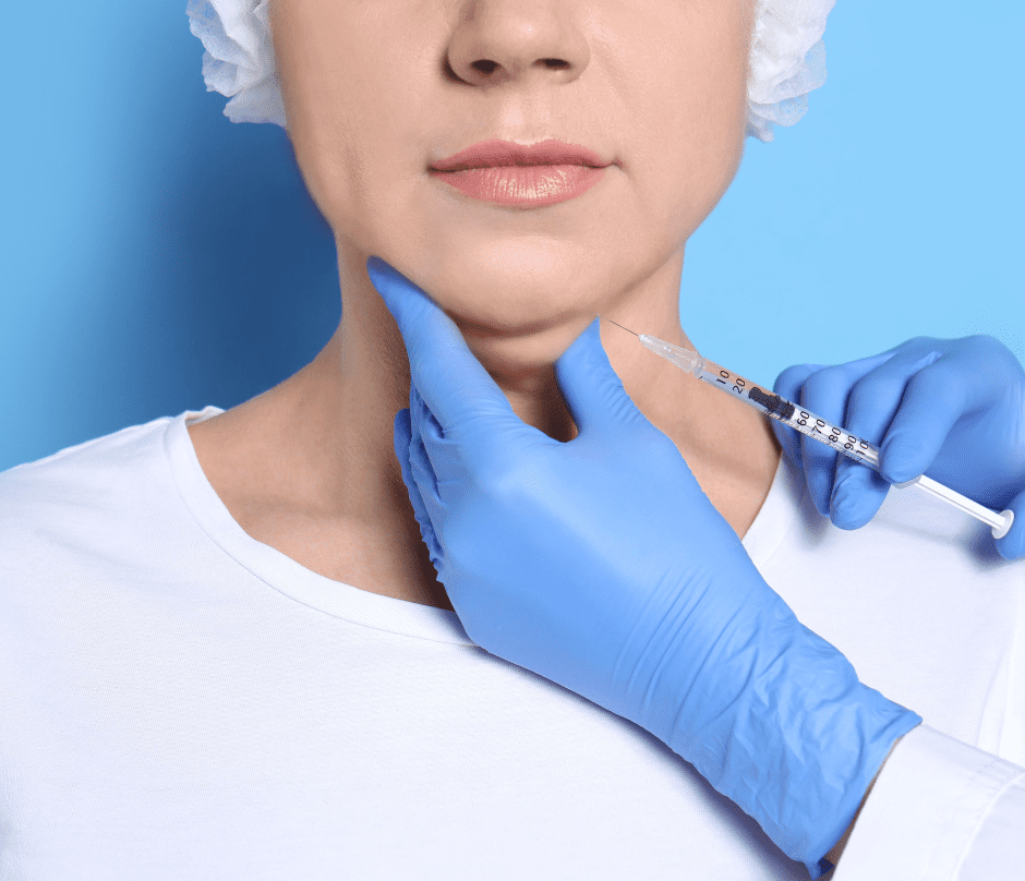 a doctor injecting her patient while holding her double chin