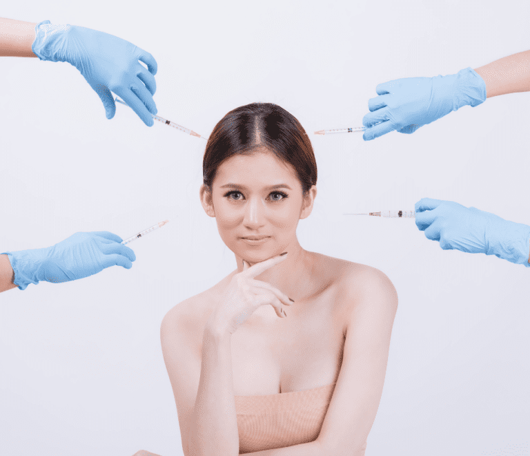 a woman and four gloved hands holding a syringe