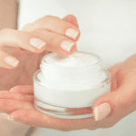 hands holding moisturizer cream