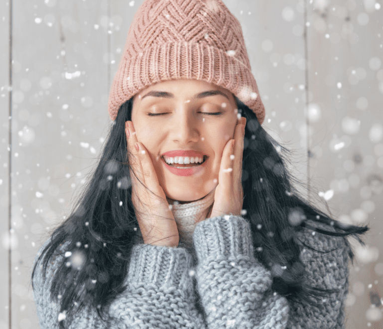 woman touching her face in cold season
