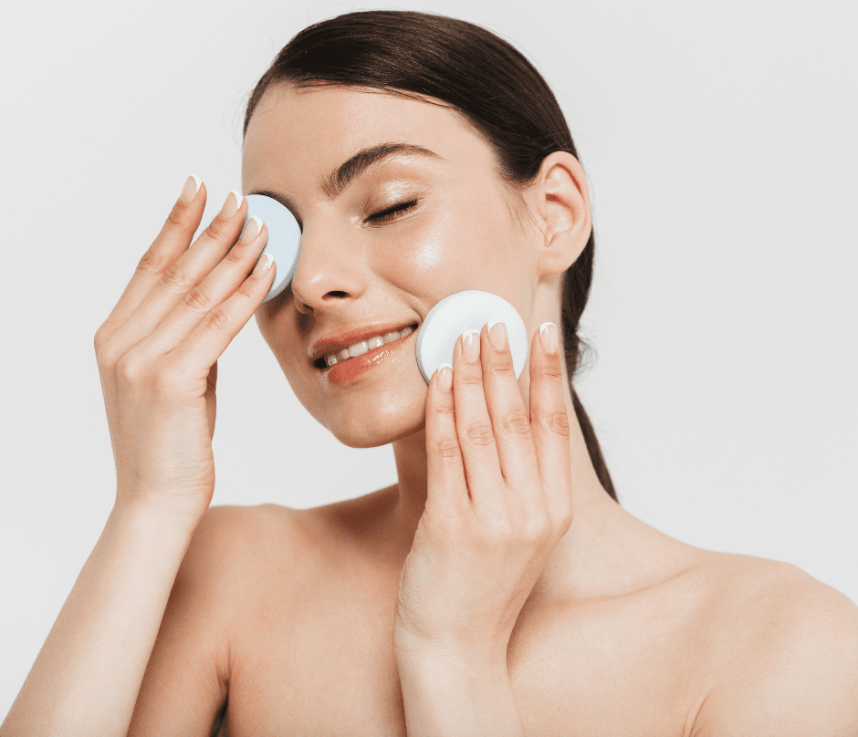 A Woman Applying Skincare To Her Face 