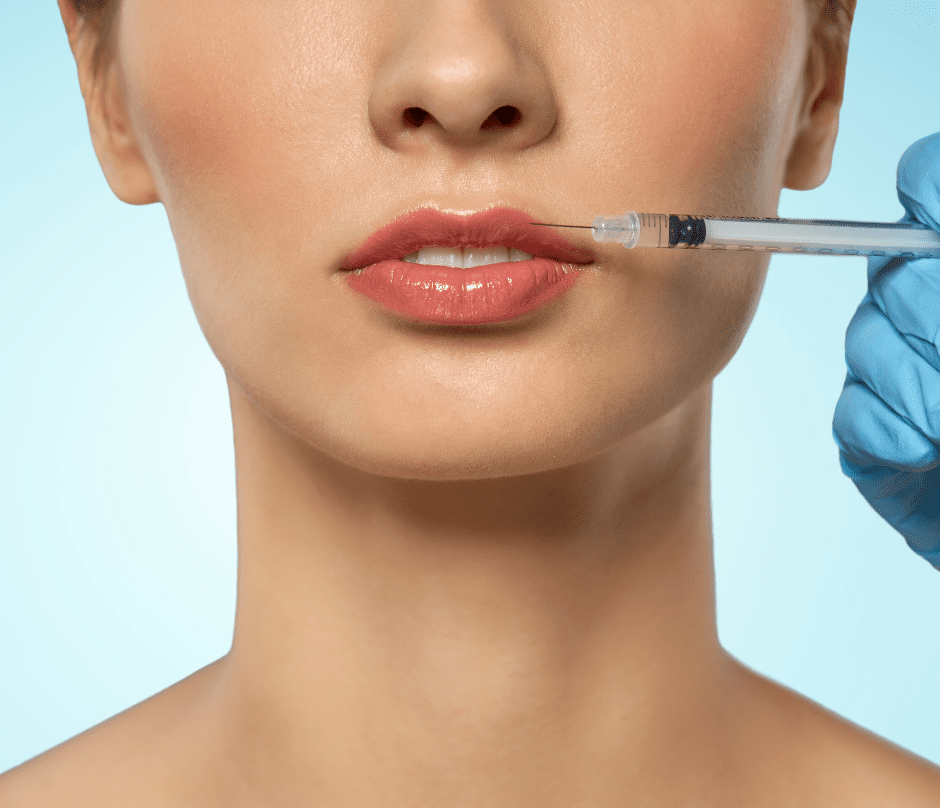 doctor's hand injecting filler into the patient lips lip trends