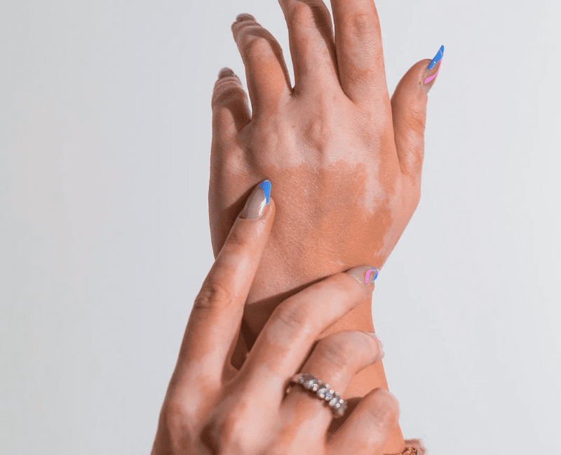 beautiful hands with blue french tip nail polish