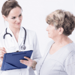 doctor talking to elder woman