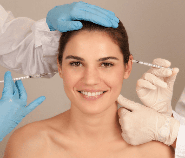 doctors injecting a patient while wearing gloves botox procedure