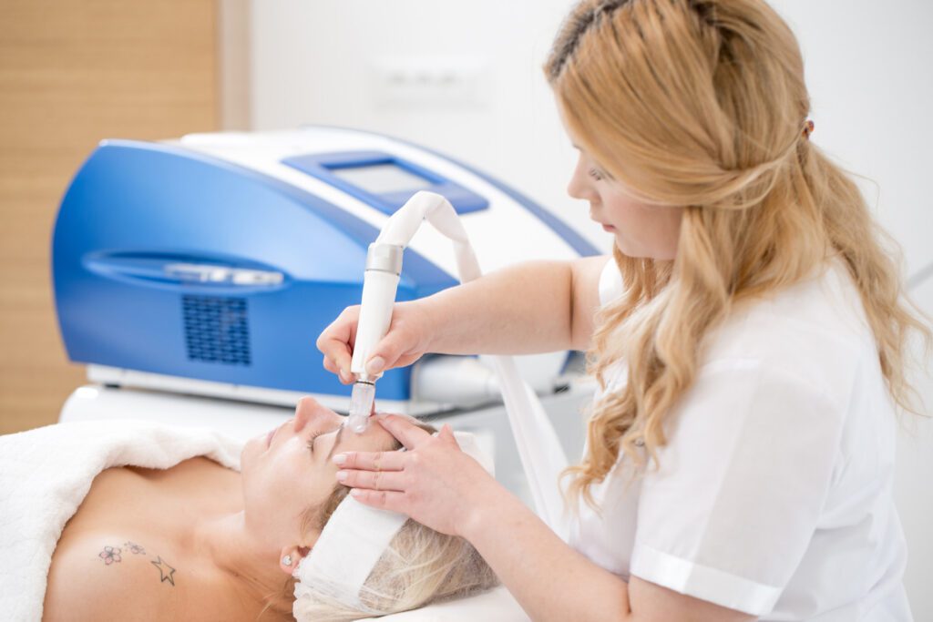 Dermatologist Giving Patient Microdermabrasion Treatment