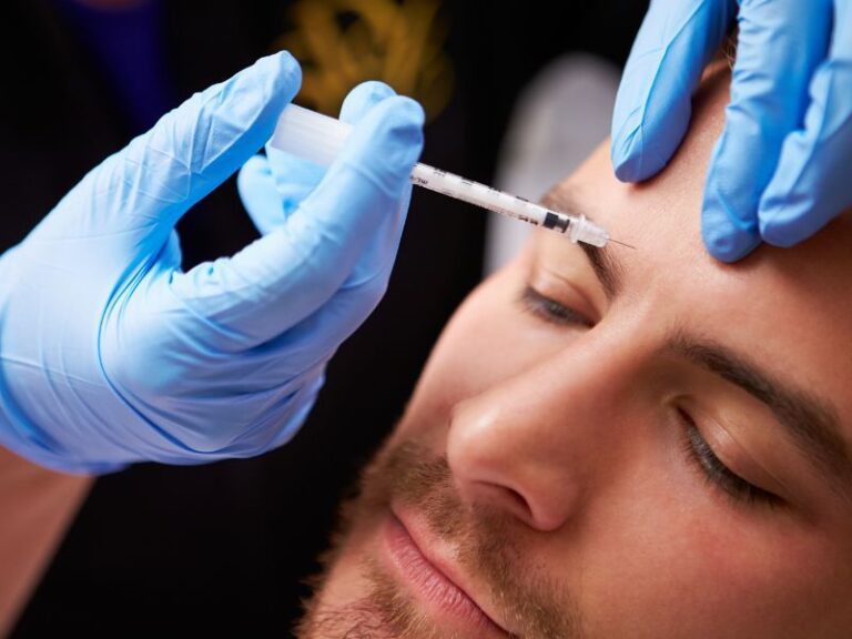 Baby Botox shot in the forehead of a man