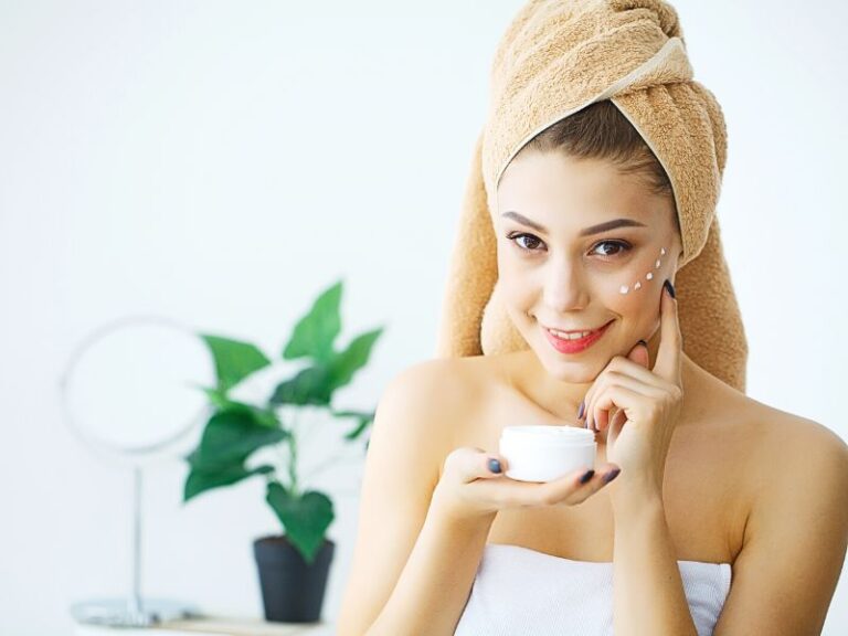 a girl applying a rejuvenation cream after taking a bath