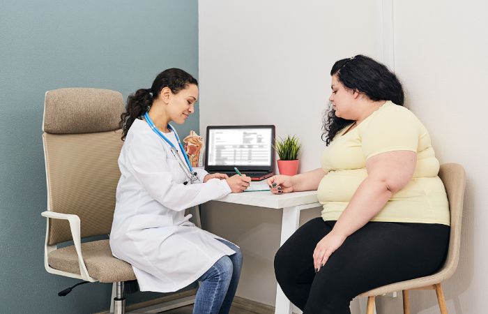 patient consulting doctor for weight loss treatment