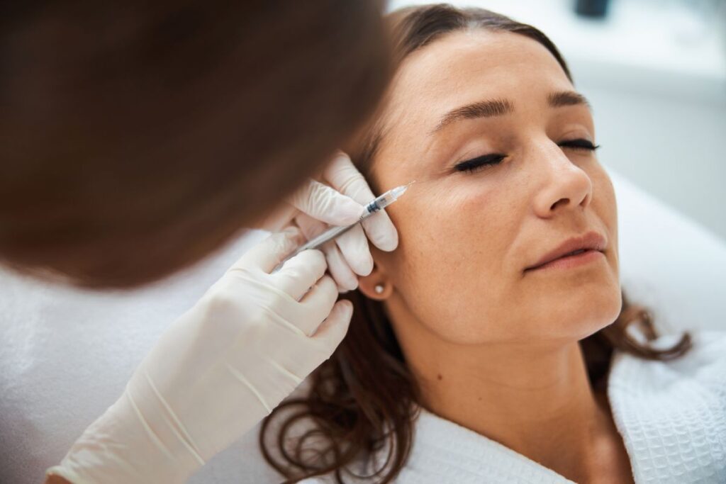 Xeomin being injected to woman's side of the eye