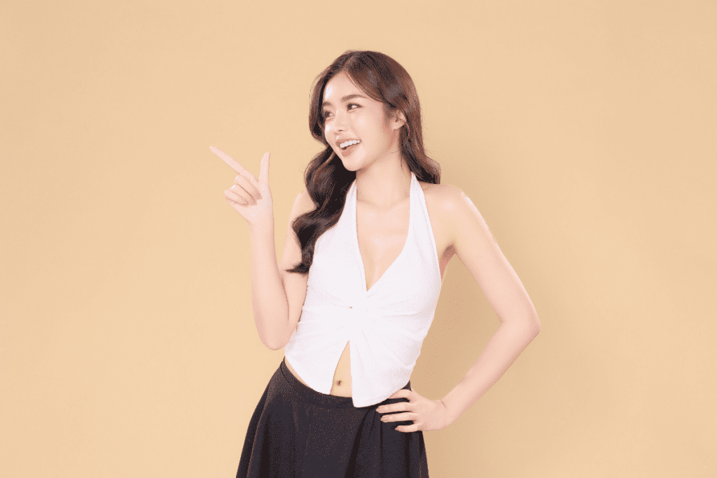 Woman pointing to info on how seasonal IV therapy addresses the body's changing nutritional needs.