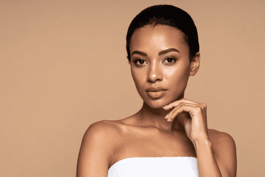 Radiant woman staying hydrated and energized with seasonal IV therapy during the hot summer months.