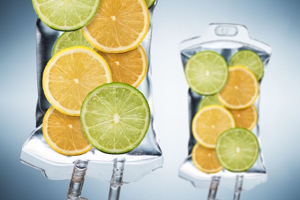 Vitamin-infused IV bags with lemons and limes to show the benefits of IV therapy vs oral supplements.