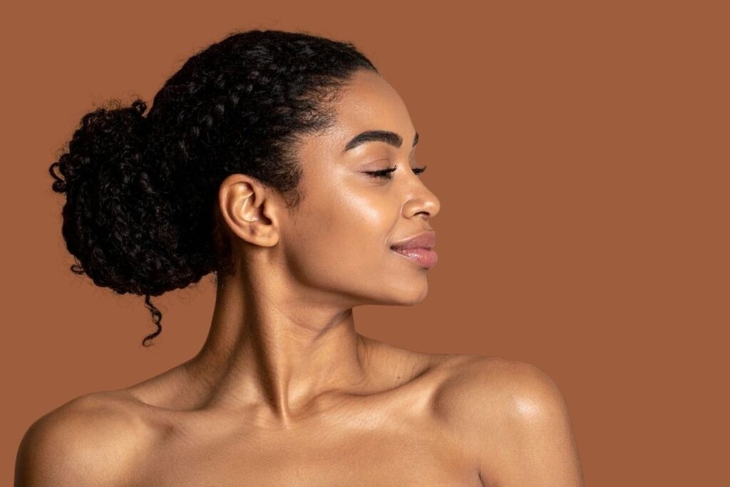Side profile of a person with a radiant complexion showcasing the results of proactive aging at Saint Aesthetix, a gender-inclusive med spa.