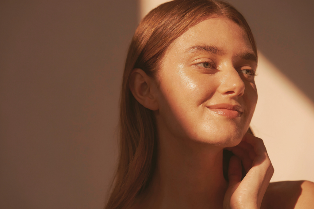 Woman bathed in warm sunlight displaying a smooth, glowing complexion following a paired microneedling PRP and laser skin treatment.