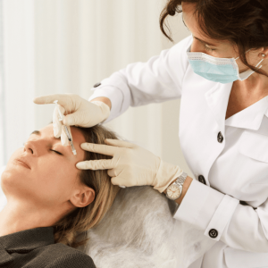 doctor injects filler into a patient's face