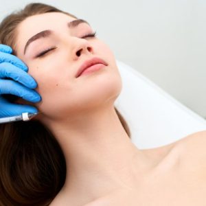 cheek filler being injected on face