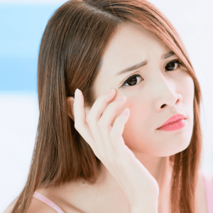 young woman worried about eye wrinkles