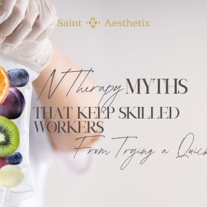 A gloved hand holds an IV bag filled with colorful fruits like kiwi, orange, berries, and grapes, illustrating IV therapy myths that keep skilled workers from trying a quick fix.
