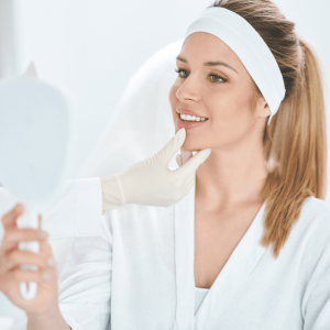 patient looking in the mirror after receiving botox