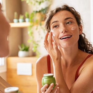 woman applying skincare