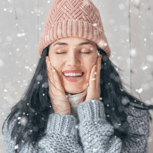 woman touching her face in cold season
